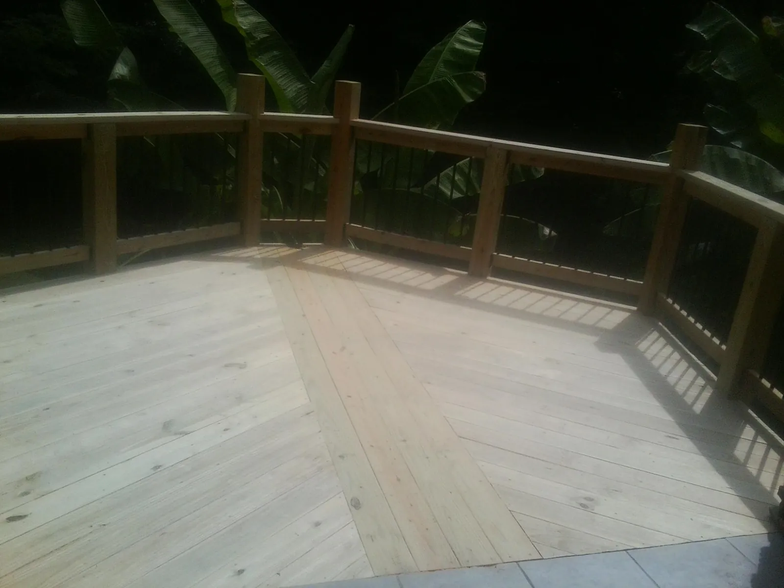New wood deck and railing built off the back of a home in South Bethlehem